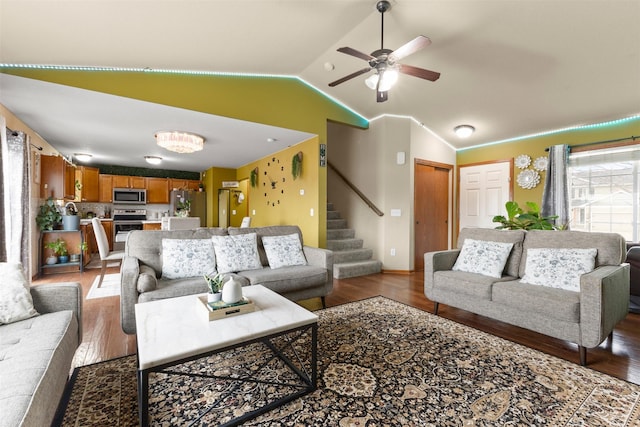 living room featuring ceiling fan, hardwood / wood-style floors, and lofted ceiling