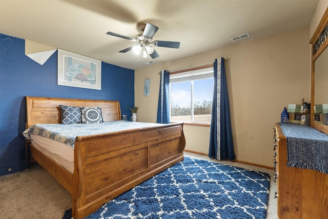 bedroom with dark colored carpet and ceiling fan