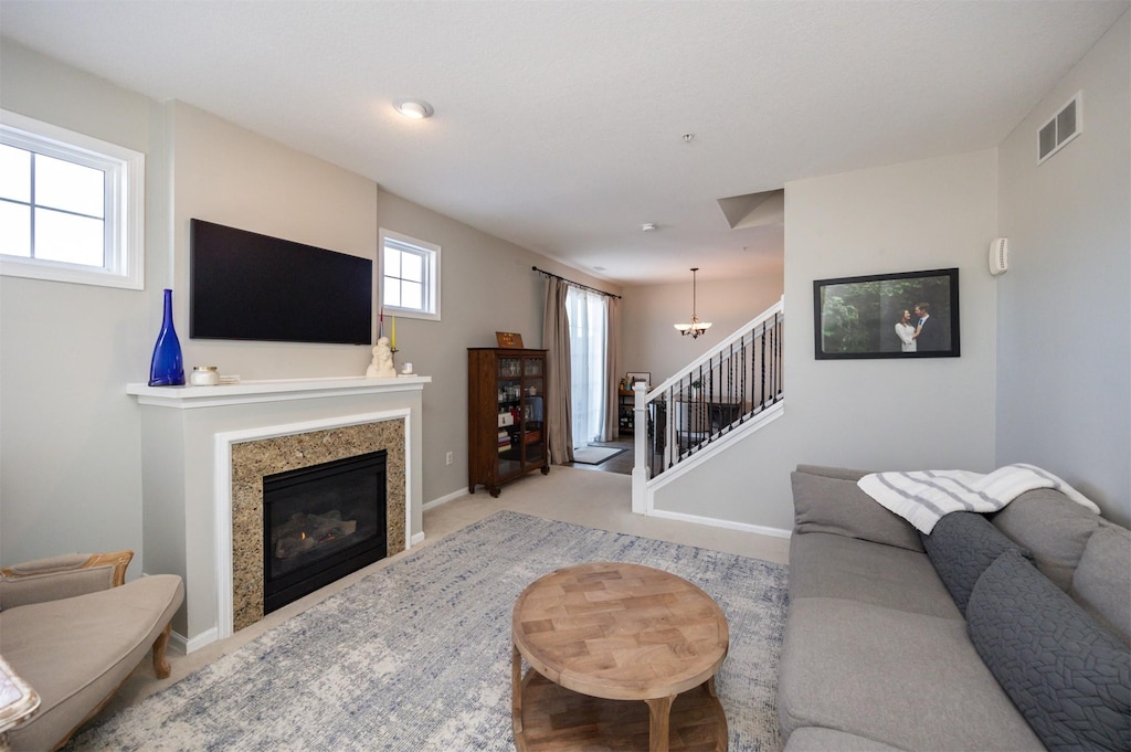 living room featuring a notable chandelier