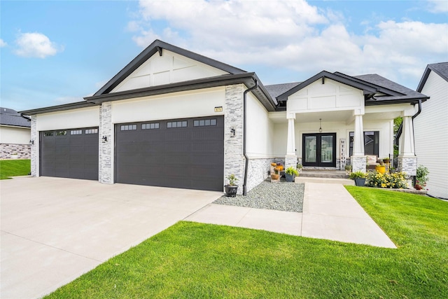 view of front of property featuring covered porch, a garage, a front lawn, and french doors