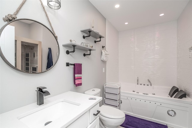 bathroom featuring a bath, vanity, and toilet