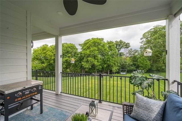 exterior space with ceiling fan and a deck