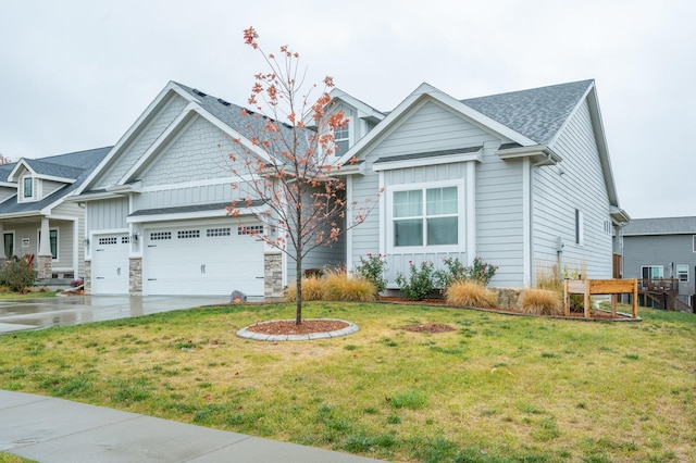 931 Breakwater Pl, Polk City, IA 50226 - view of front of property featuring board and batten siding, a garage, a front yard, and driveway
