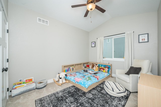 bedroom with carpet floors, visible vents, vaulted ceiling, and a ceiling fan