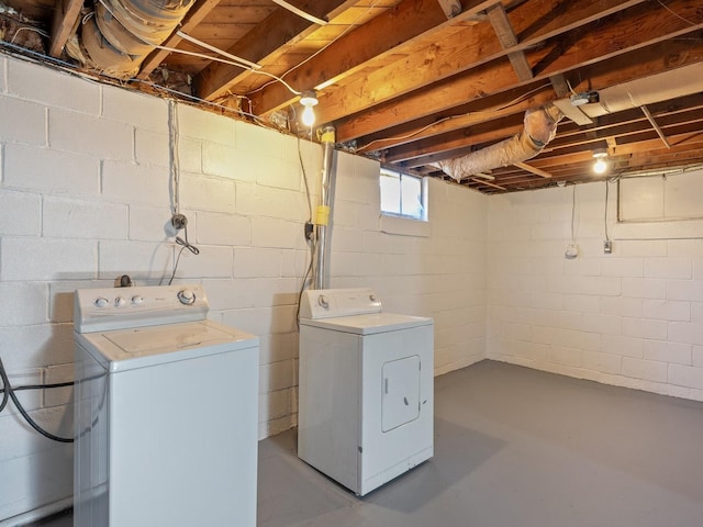 clothes washing area featuring washer and clothes dryer