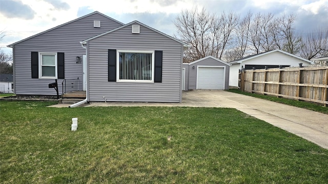 view of front of house with concrete driveway, an outdoor structure, a front lawn, a garage, and fence