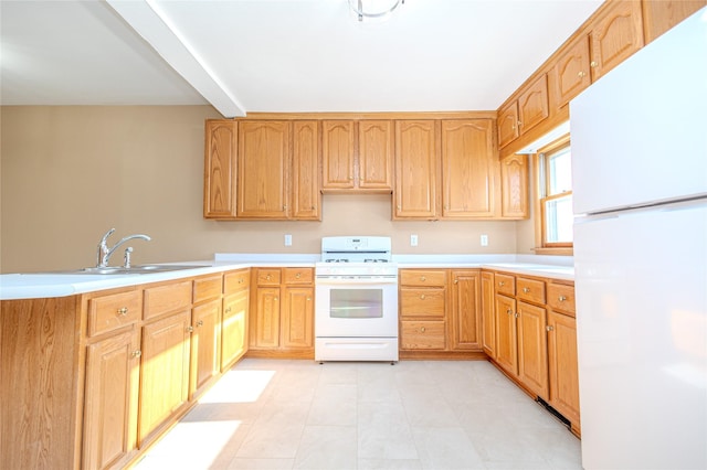 kitchen with white appliances and sink