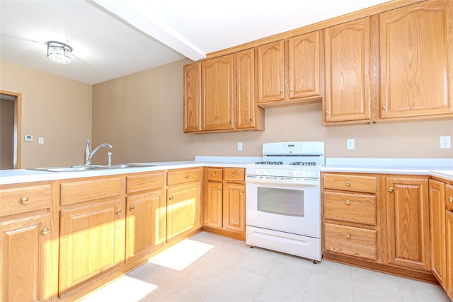 kitchen with beam ceiling, white range with gas cooktop, and sink