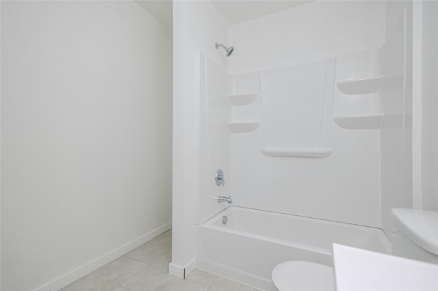 bathroom with shower / washtub combination, tile patterned flooring, and toilet