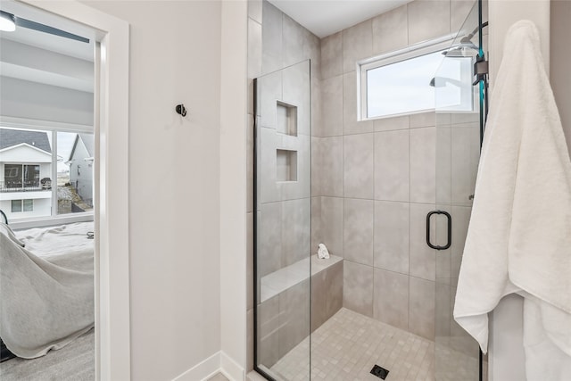 bathroom with a shower with shower door