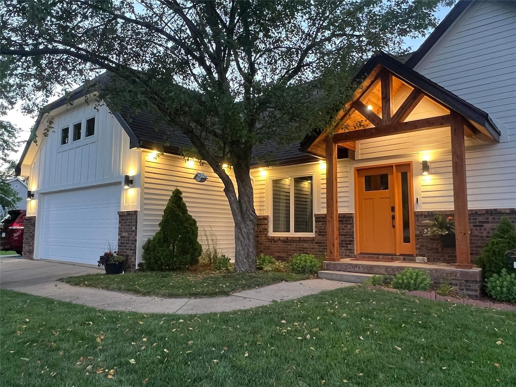 view of front facade with a front lawn and a garage