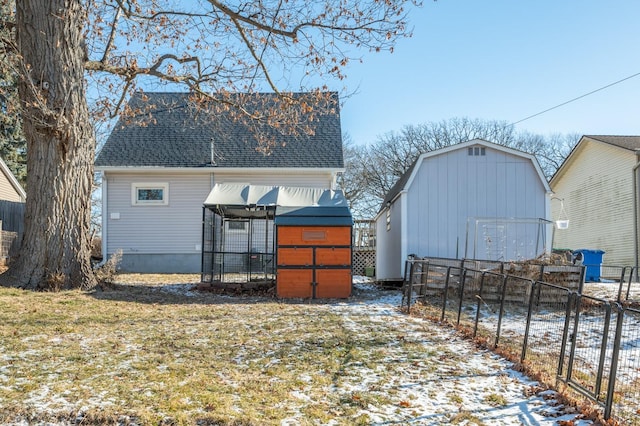 exterior space featuring a yard and a storage unit