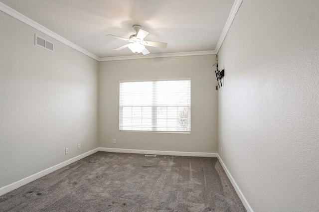 empty room featuring carpet flooring, ceiling fan, and crown molding