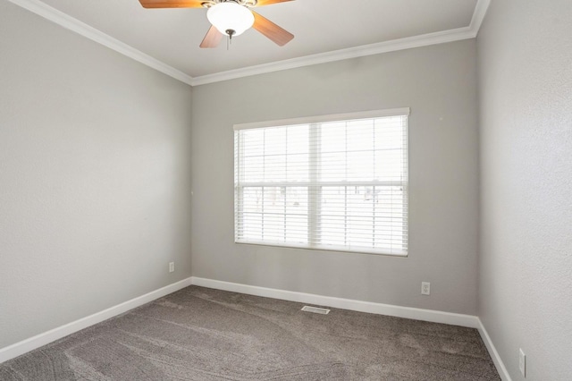 carpeted empty room featuring crown molding, ceiling fan, and a healthy amount of sunlight