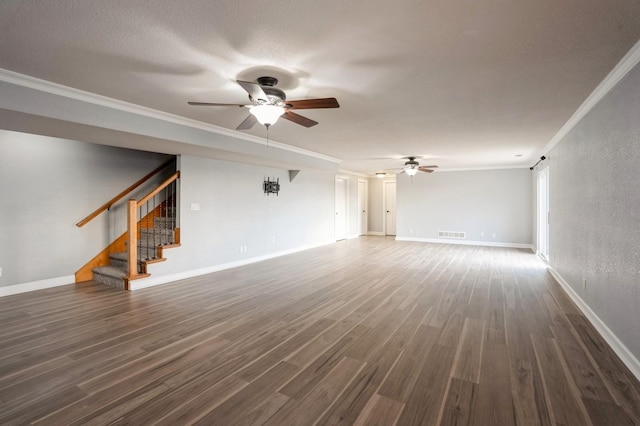 unfurnished living room with ceiling fan, crown molding, and dark wood-type flooring