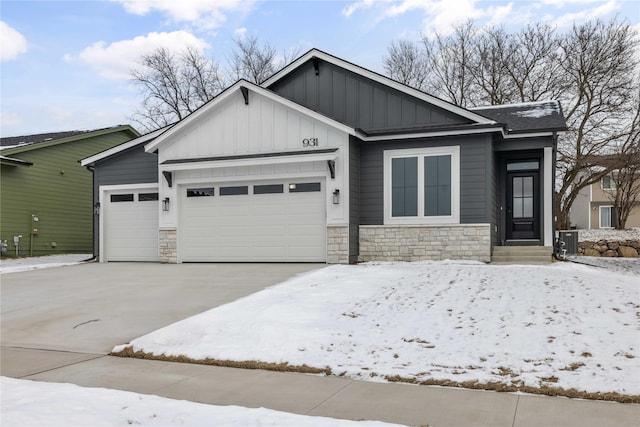 view of front of property with cooling unit and a garage