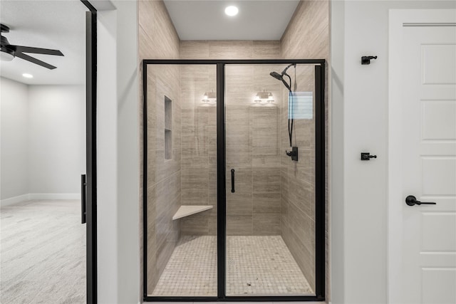 bathroom featuring ceiling fan and walk in shower