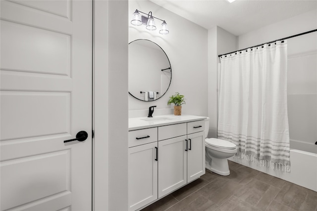 full bathroom featuring vanity, shower / bath combination with curtain, and toilet