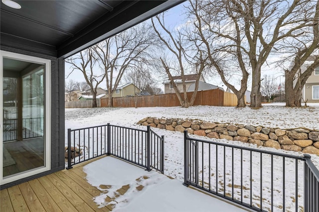 view of snow covered deck