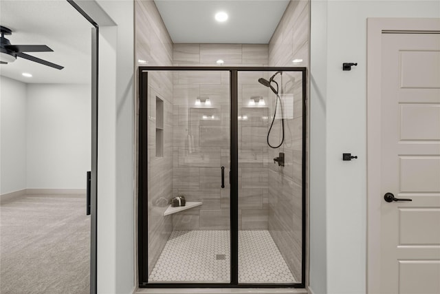 bathroom featuring ceiling fan and walk in shower