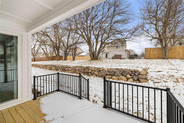 view of snow covered deck