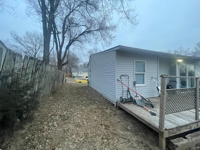 view of home's exterior featuring a wooden deck