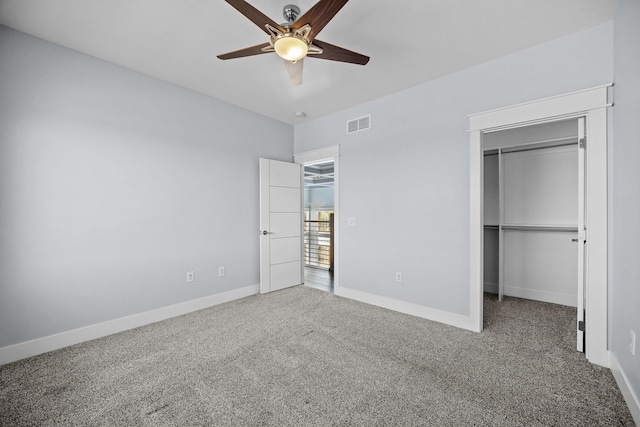 unfurnished bedroom featuring carpet floors, a closet, and ceiling fan