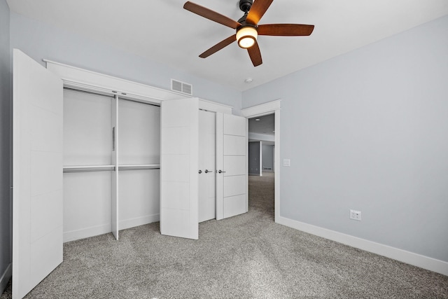 unfurnished bedroom featuring carpet flooring and ceiling fan