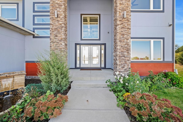 view of exterior entry featuring french doors