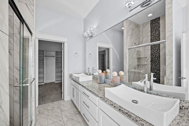 bathroom with vanity and an enclosed shower