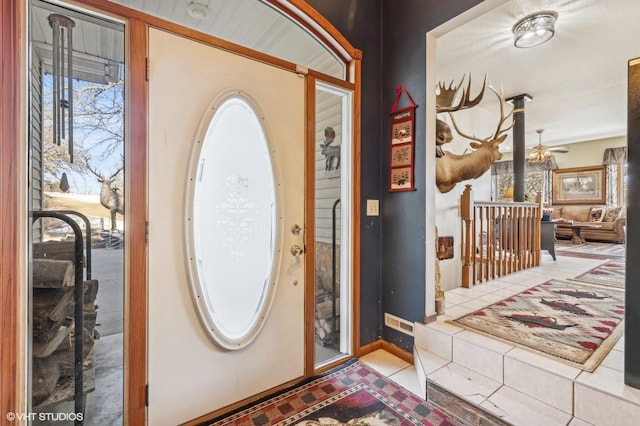 entrance foyer featuring ceiling fan