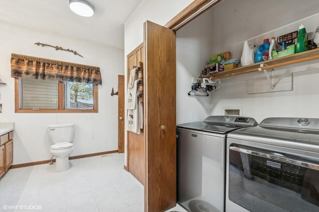 clothes washing area with independent washer and dryer