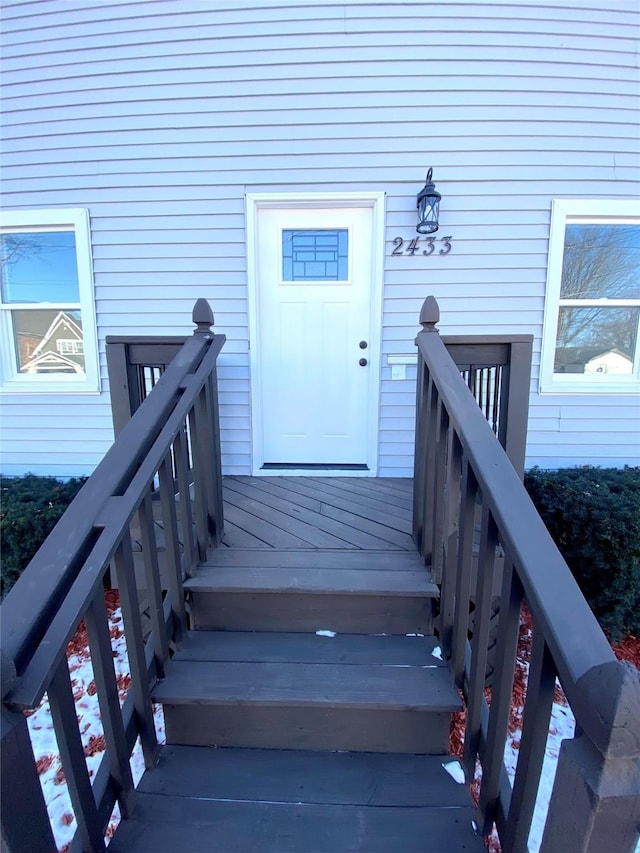 doorway to property featuring a wooden deck