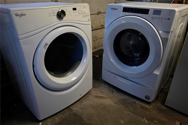 clothes washing area with independent washer and dryer