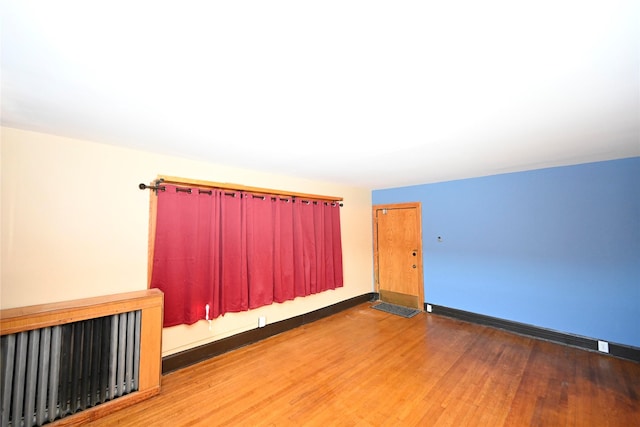 unfurnished room featuring wood-type flooring