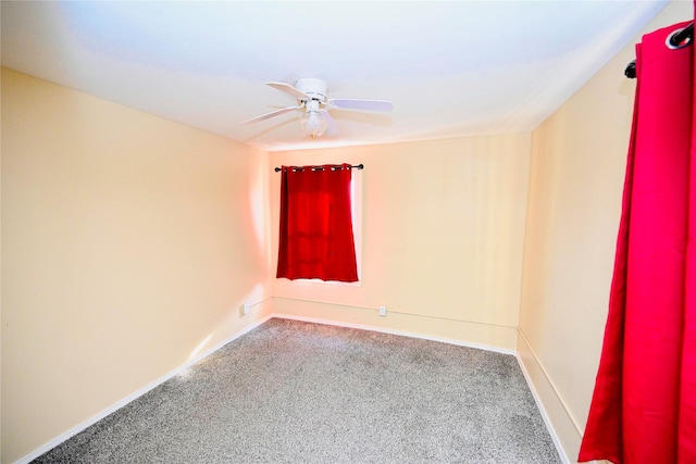 unfurnished room featuring ceiling fan and carpet floors