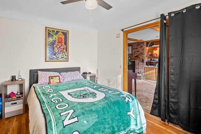 bedroom featuring hardwood / wood-style floors and ceiling fan