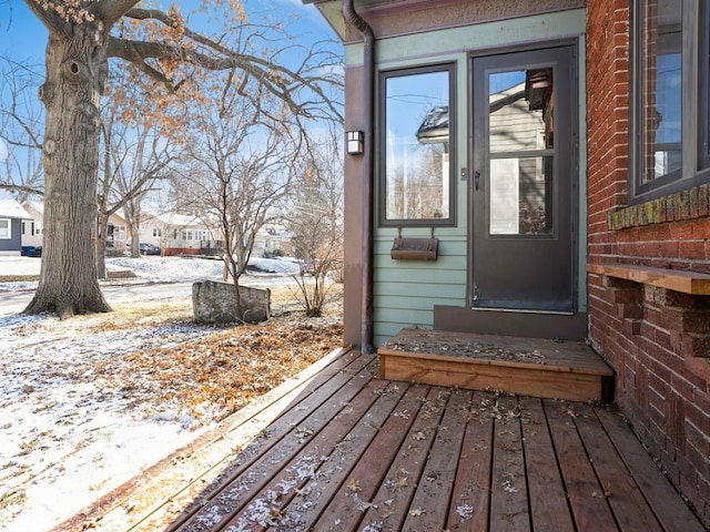 view of snow covered property entrance