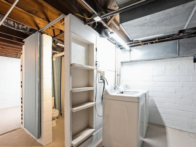 basement featuring washing machine and clothes dryer