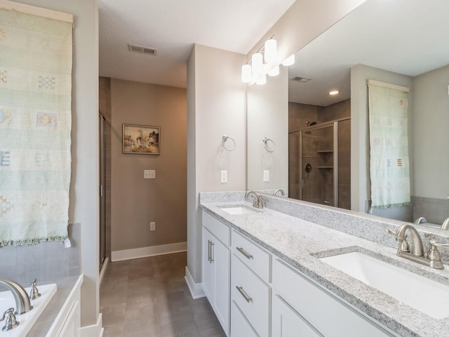 bathroom with shower with separate bathtub and vanity