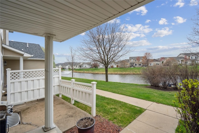 756 SE Williams Ct, Waukee, IA 50263 - view of patio featuring a water view and a residential view