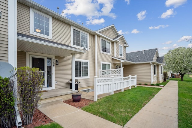 756 SE Williams Ct, Waukee, IA 50263 - view of front of property with a front yard, crawl space, and roof with shingles