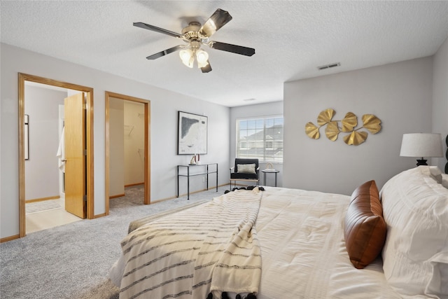756 SE Williams Ct, Waukee, IA 50263 - bedroom with carpet floors, baseboards, ceiling fan, and a textured ceiling