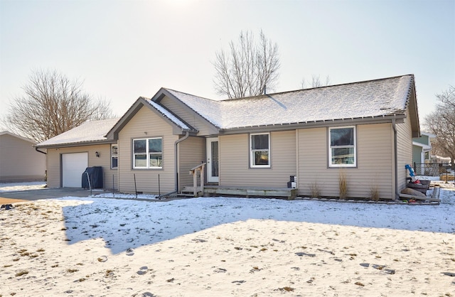 ranch-style house featuring a garage