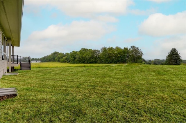 view of yard with a rural view