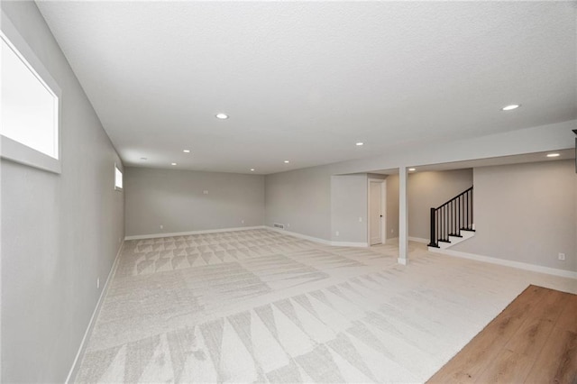 basement with light colored carpet