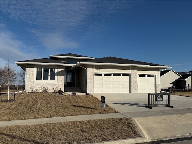 prairie-style home featuring a garage