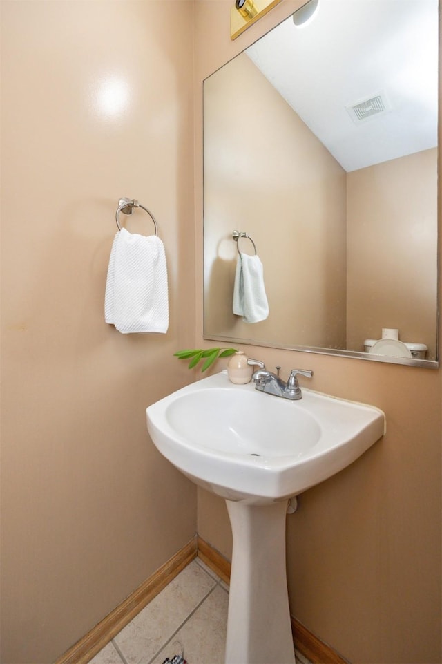 bathroom featuring tile patterned flooring and sink