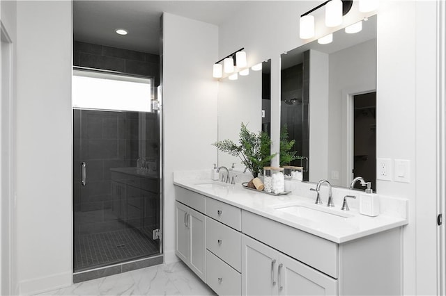 bathroom with walk in shower and vanity