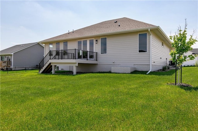 back of house featuring a yard